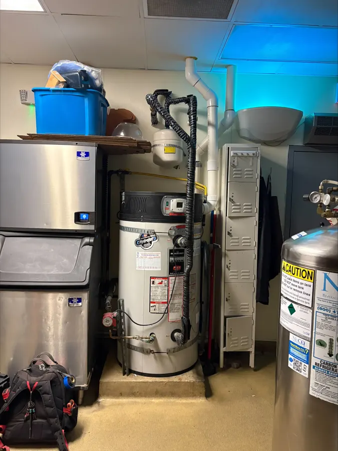 Tank water heaters and tankless units in a commercial equipment room